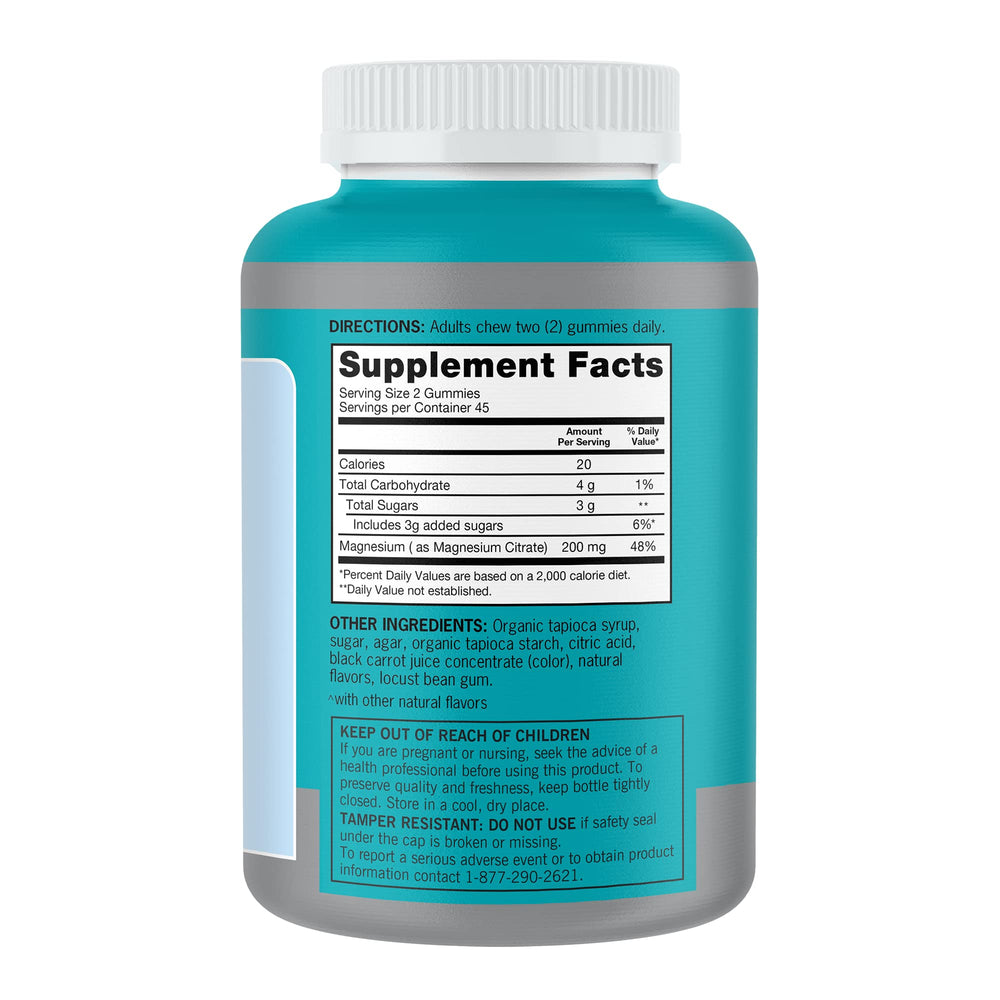 Qunol Magnesium Gummies bottle with glass lifestyle setup