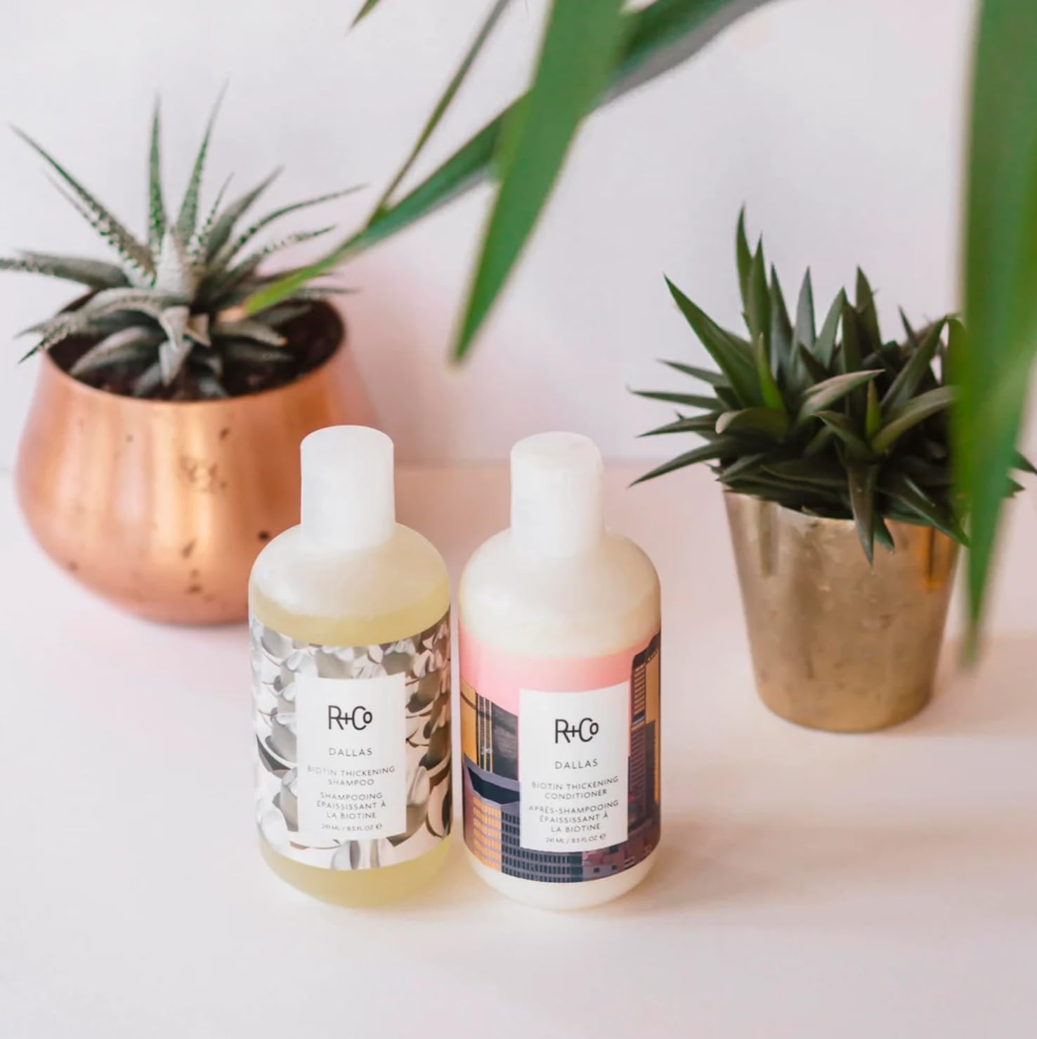 R+Co Dallas Thickening Shampoo in hand during routine, easy to apply.