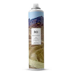 R+Co Death Valley dry shampoo bottle boosts volume at the roots for lift.