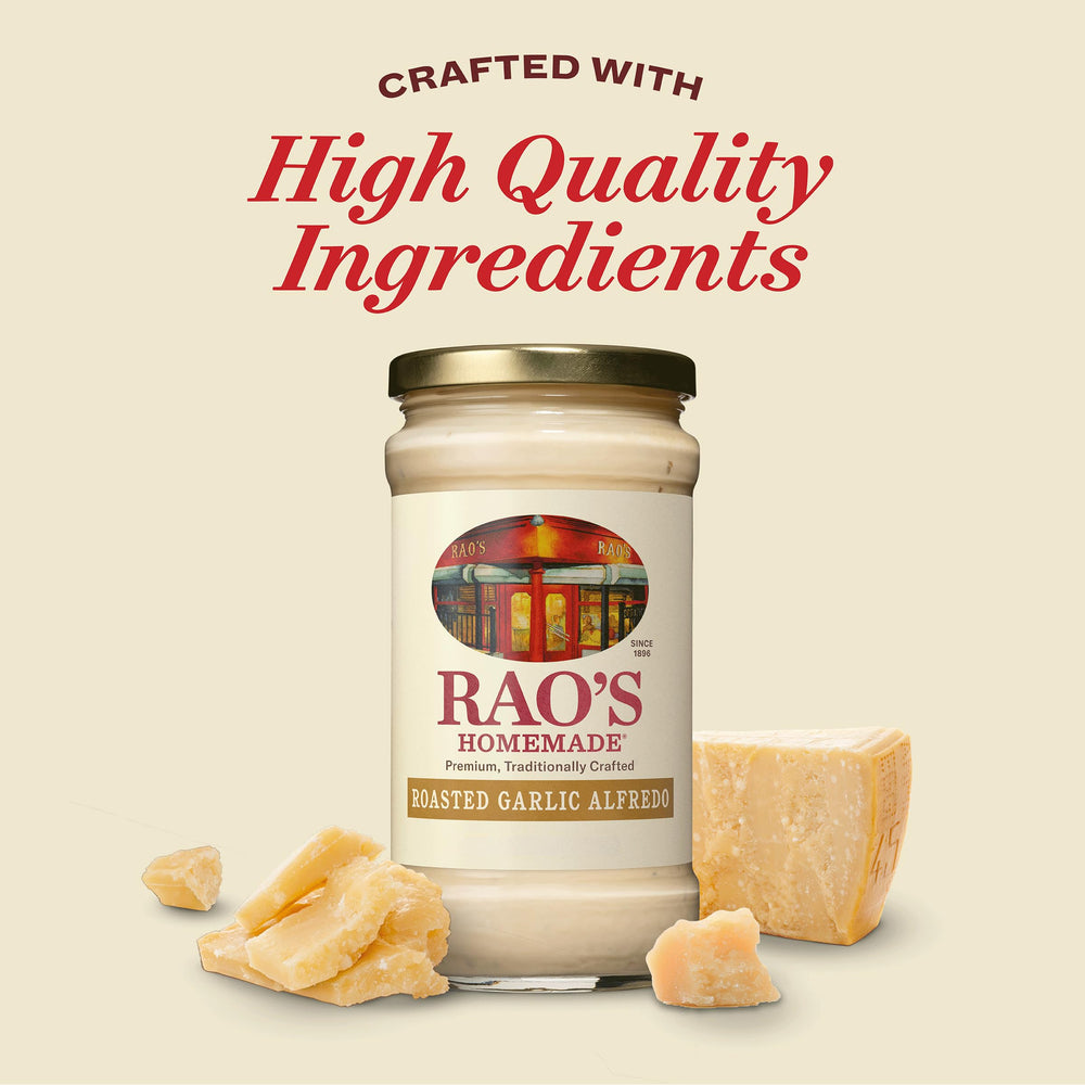 Pouring Rao's Alfredo sauce over pasta to create a creamy dish