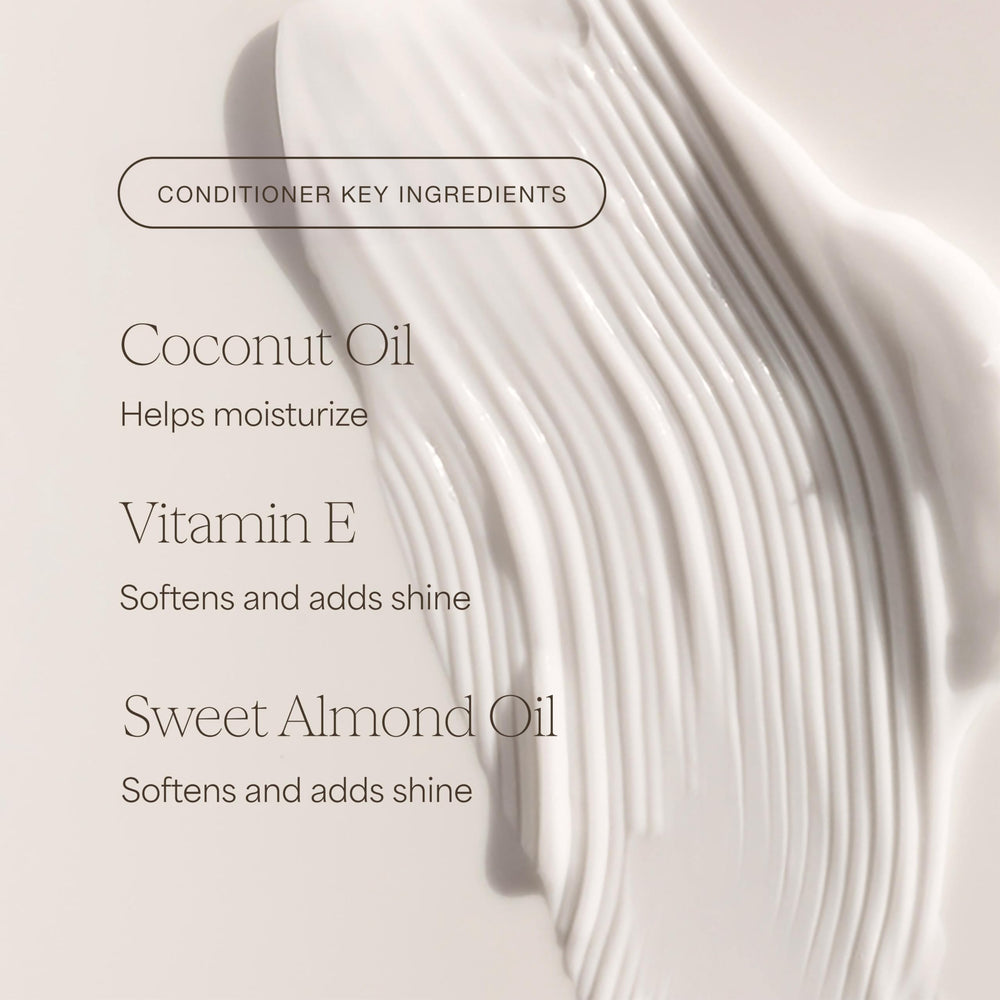 Shampoo and conditioner duo on a bathroom shelf ready for routine