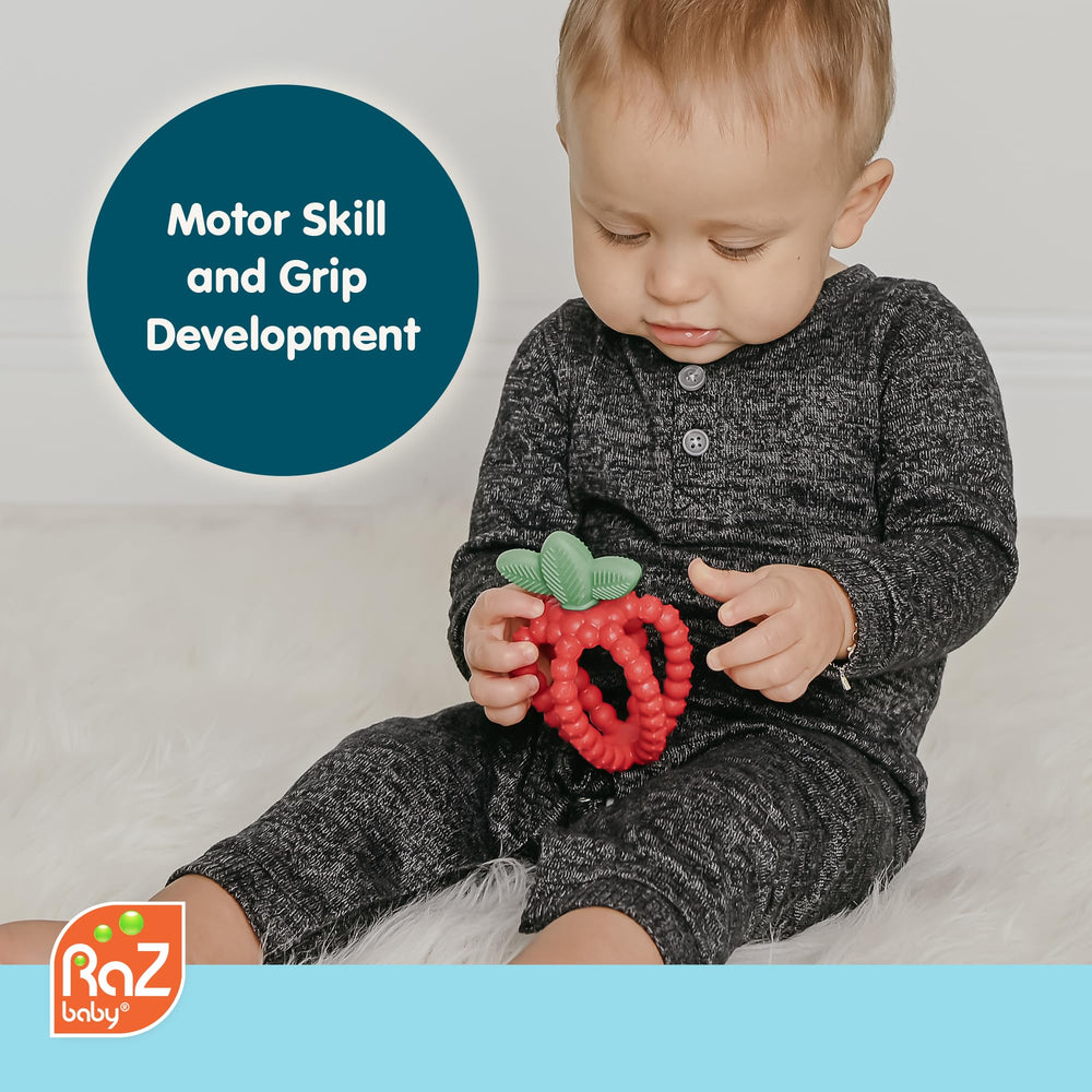 RaZbaby Bites strawberry-shaped teether with soft silicone for easy grip