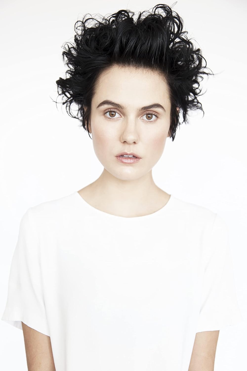 Damp hair application using Aircraft Pomade Mousse enables even distribution.