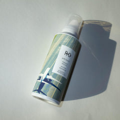 R+Co Aircraft Pomade Mousse foam texture shows light non-sticky hold with airy volume.