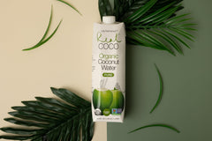Fresh coconuts on a farm emphasize Real Coco’s straight-from-source quality.