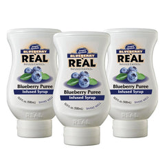 Reàl Infused Exotics Blueberry bottle pour shows drip-free mixing for drinks.
