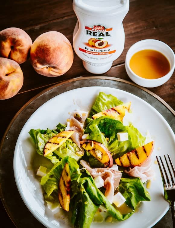 Reàl Infused Exotics blueberry syrup bottle enriches baked goods and beverages