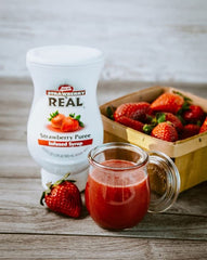 Vibrant strawberry-infused liquid close-up in Reàl syrup