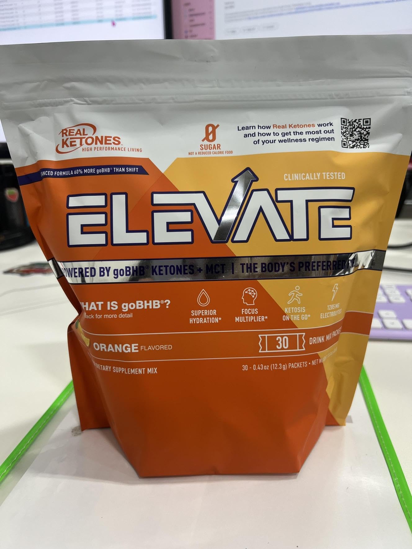 Real Ketones orange packets with scoop show easy portion control