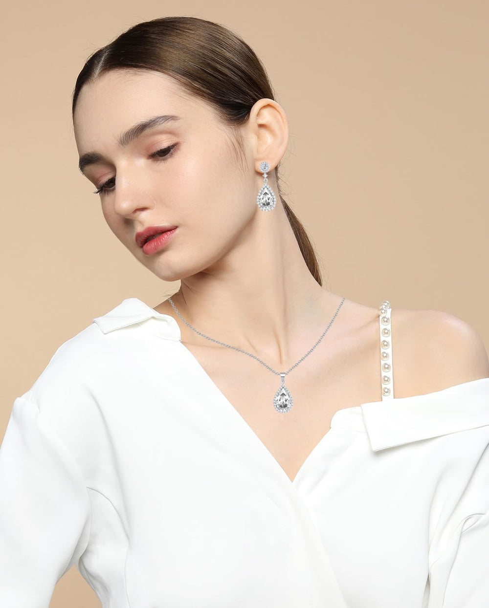 REASAYLL Austrian crystal center teardrop earrings add refined evening shine.
