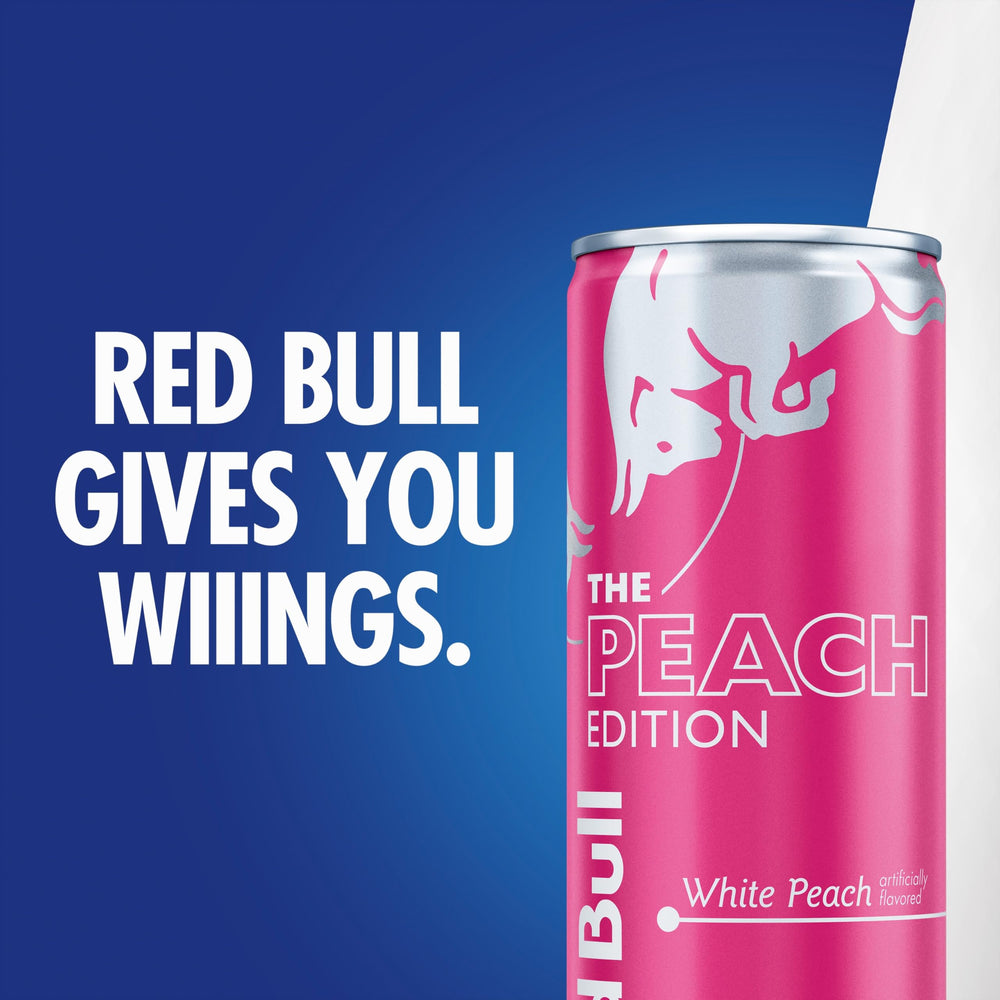 Red Bull Peach Edition nutrition panel on the can highlights caffeine and vitamins.