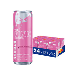 Red Bull Pink Edition Wild Berries can on desk, energizing for workouts.