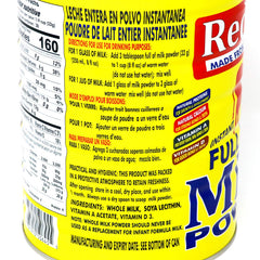 Scoop of Red Cow milk powder with a measuring spoon for precise portions.