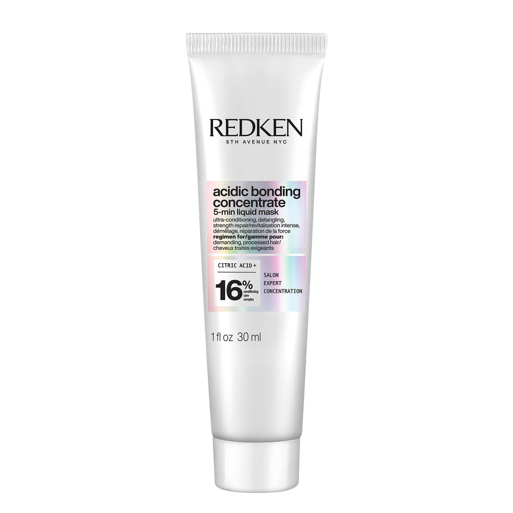 Redken Acidic Bonding Concentrate bottle pour for quick hydration.