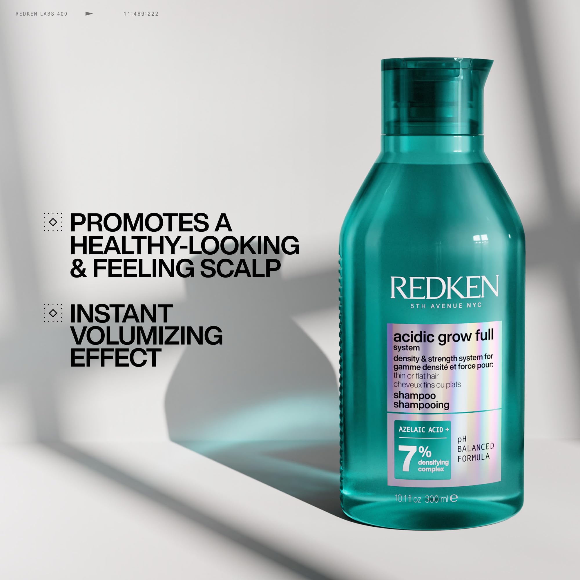 Kit display highlights complete Acidic Grow Full System for fuller-looking hair possibilities.