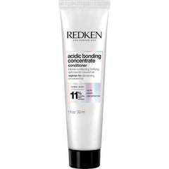 Redken Bonding Concentrate Conditioner bottle close-up highlighting repair benefits for damaged hair