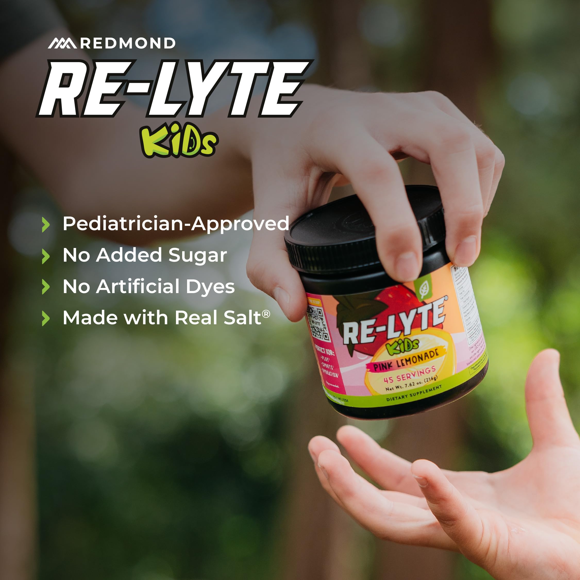 Active kid on the go using Redmond Re-Lyte Kids Pink Lemonade during sports.
