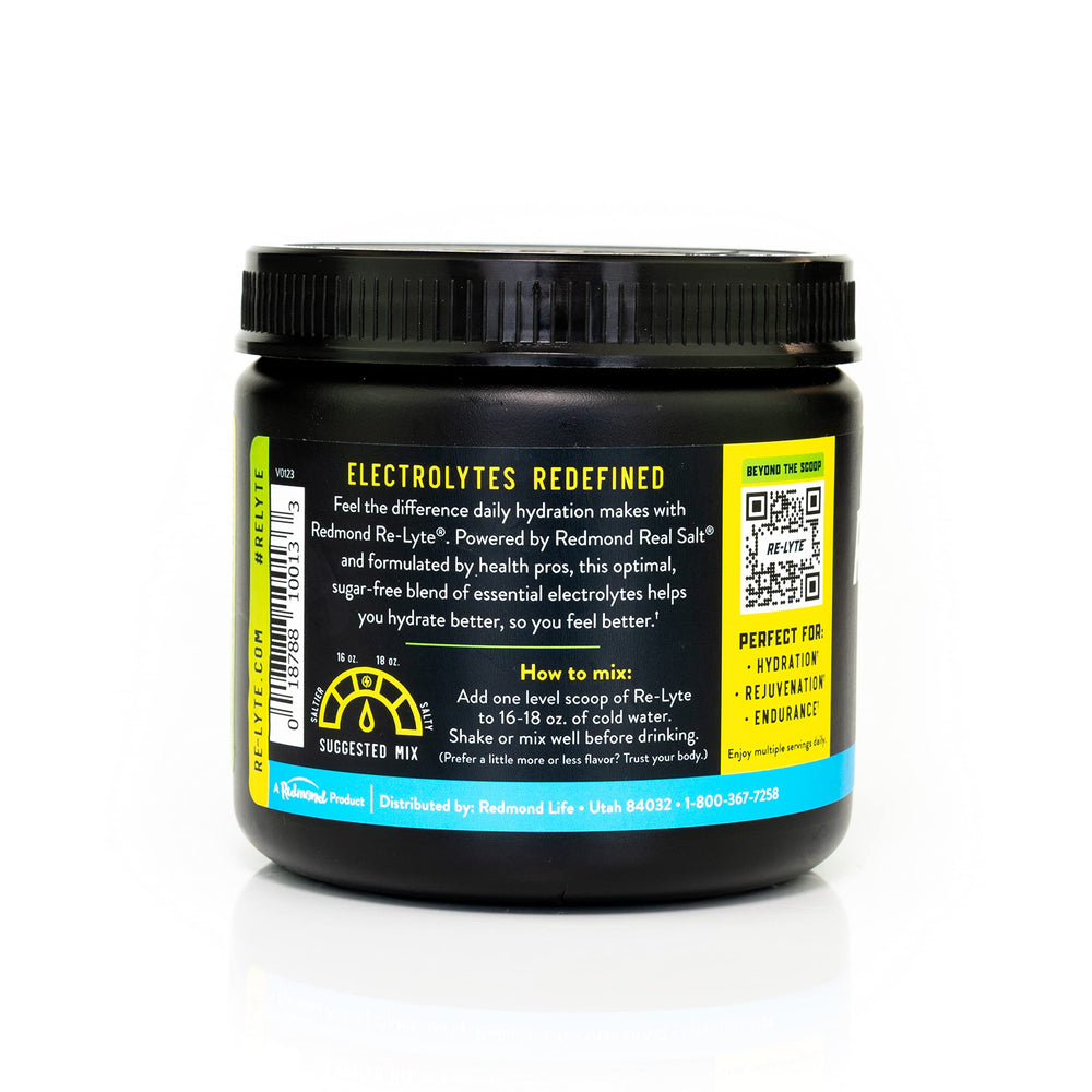 REDMOND Re-Lyte lemon-lime powder being poured into water for refreshing hydration.