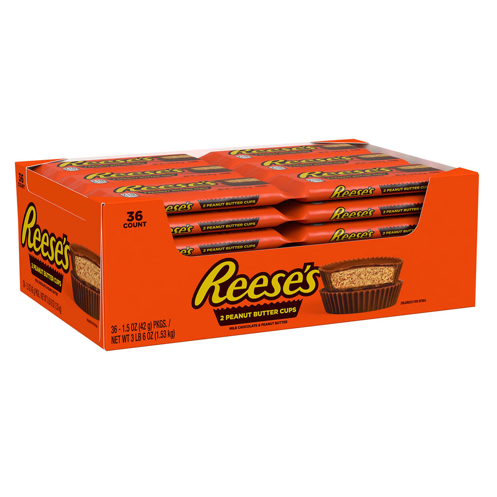Hand reaching for REESE'S cup, ideal snack during sports events or game night