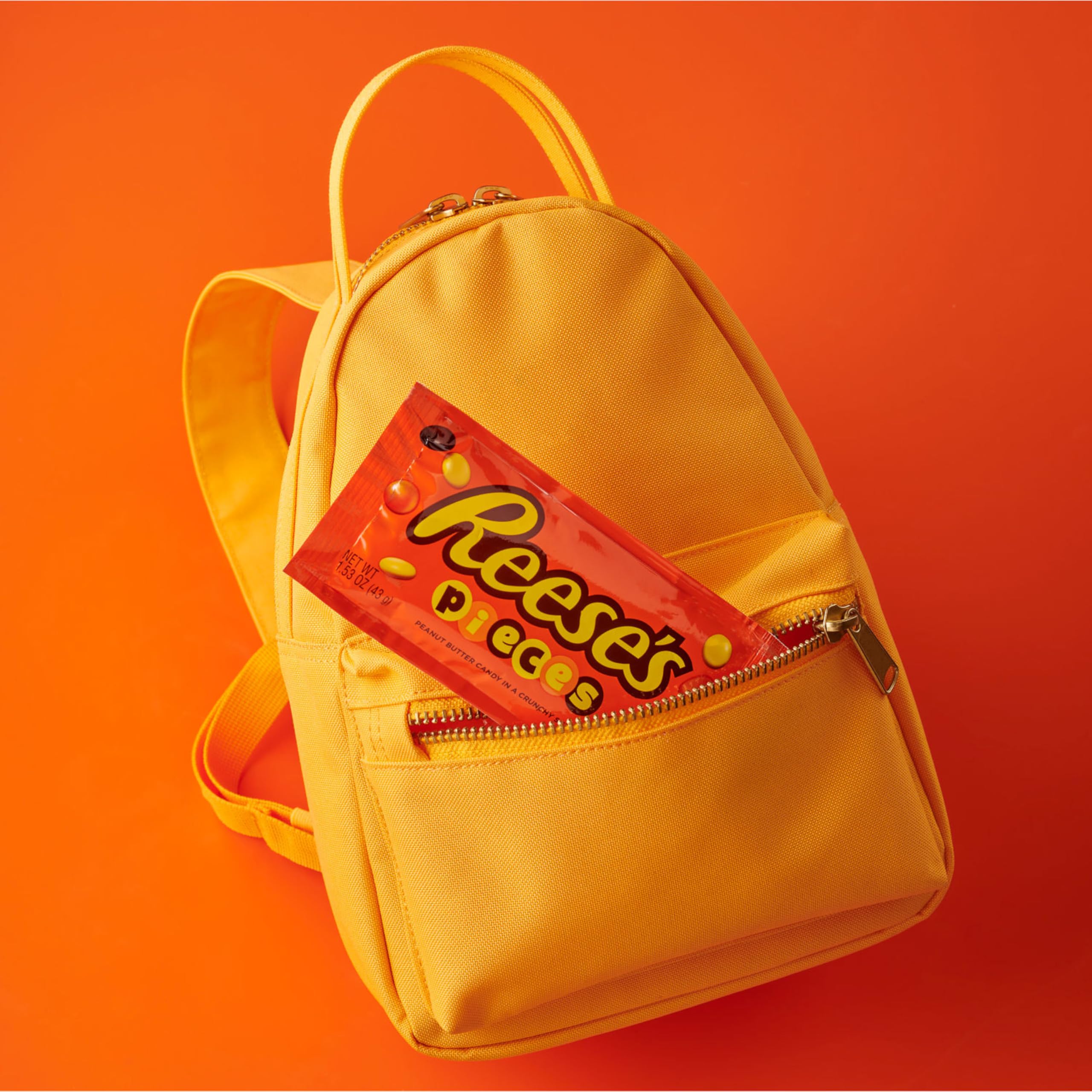 REESE'S PIECES movie-night setup beside a dessert plate