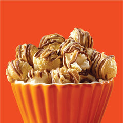 Reese's Popcorn poured in bowl, ready for sharing at gatherings.