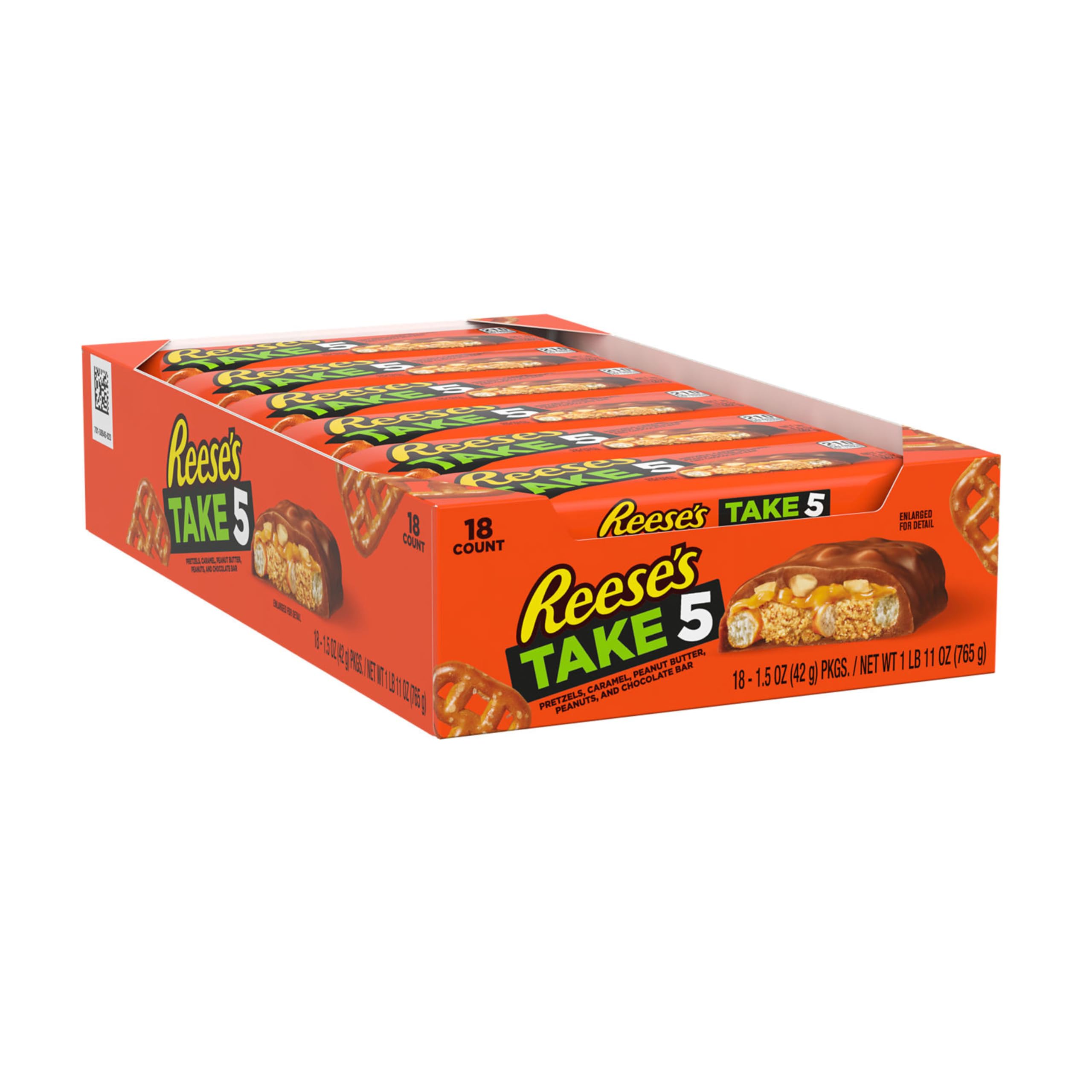 REESE'S Take 5 bar cross-section reveals pretzel, caramel, peanut butter, peanuts, chocolate.