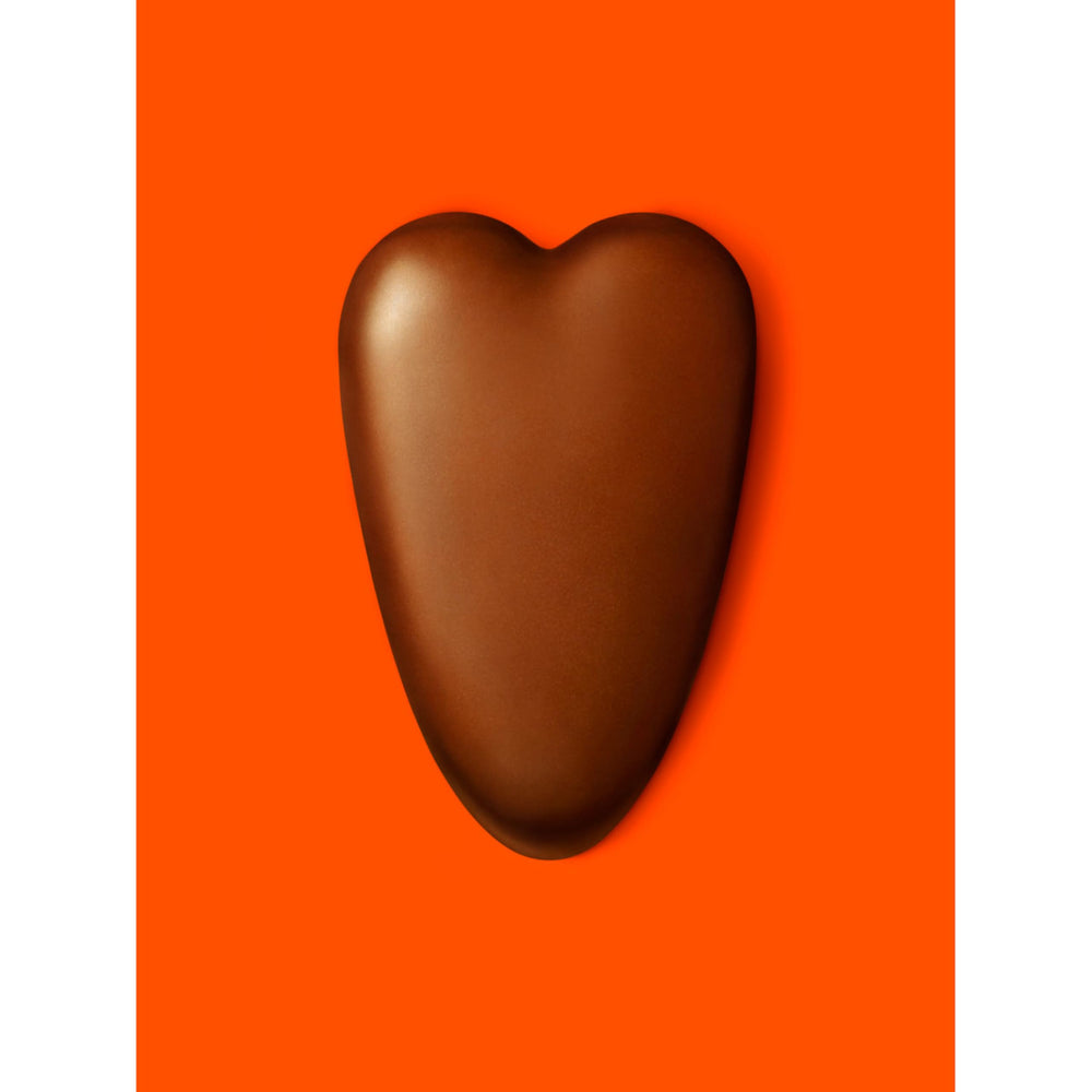 Valentine gift pack featuring Reese's hearts with card and flowers for gifting.