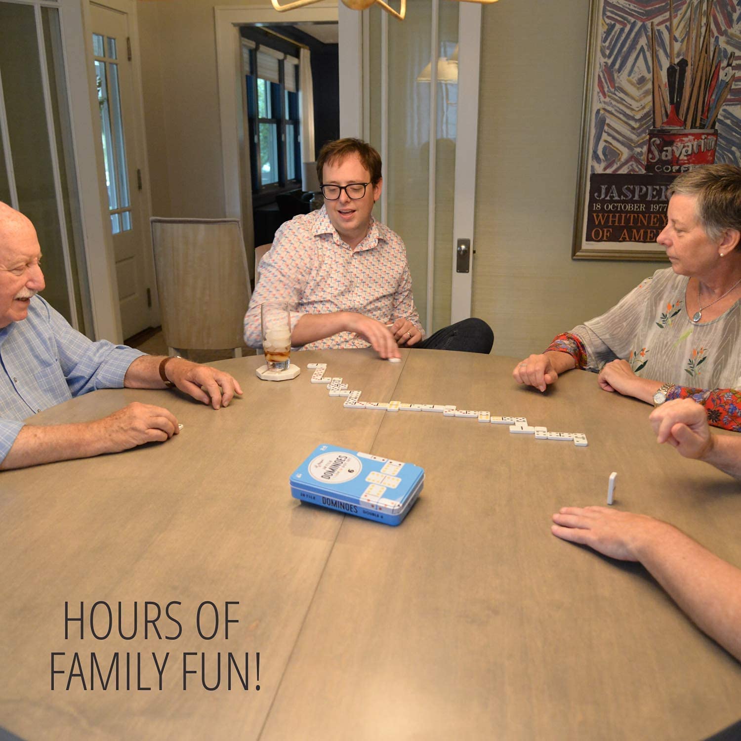 Regal Games dominoes in hands highlight easy handling for kids.