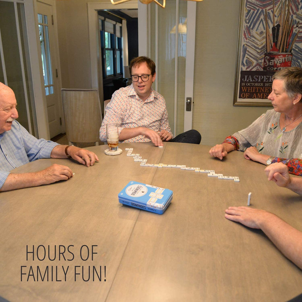 Regal Games dominoes in hands highlight easy handling for kids.