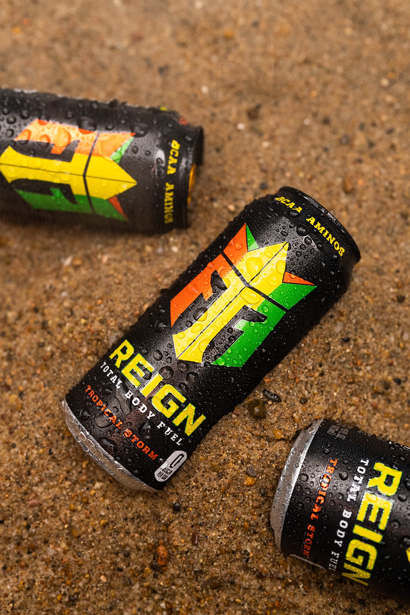 12-pack display of REIGN Tropical Storm emphasizes bulk convenience for gym-goers.