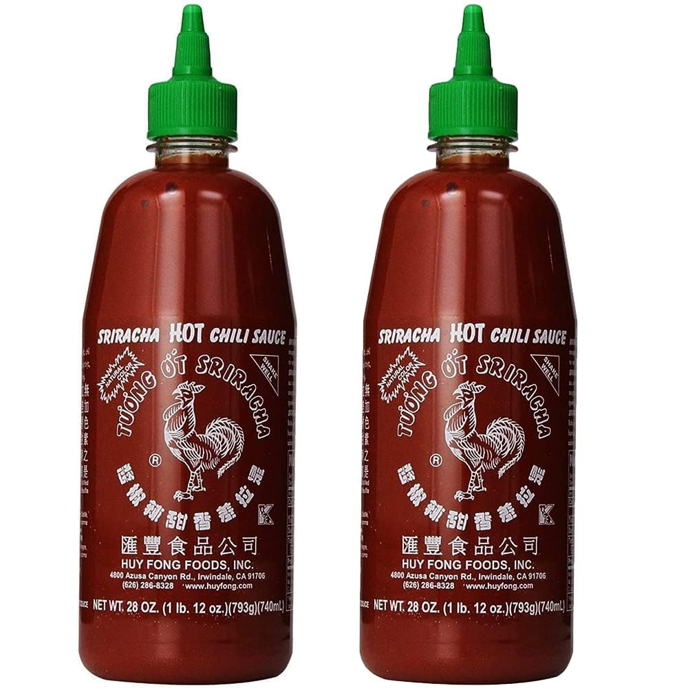 Rex Sriracha bottle pours with bold heat for dipping or cooking.