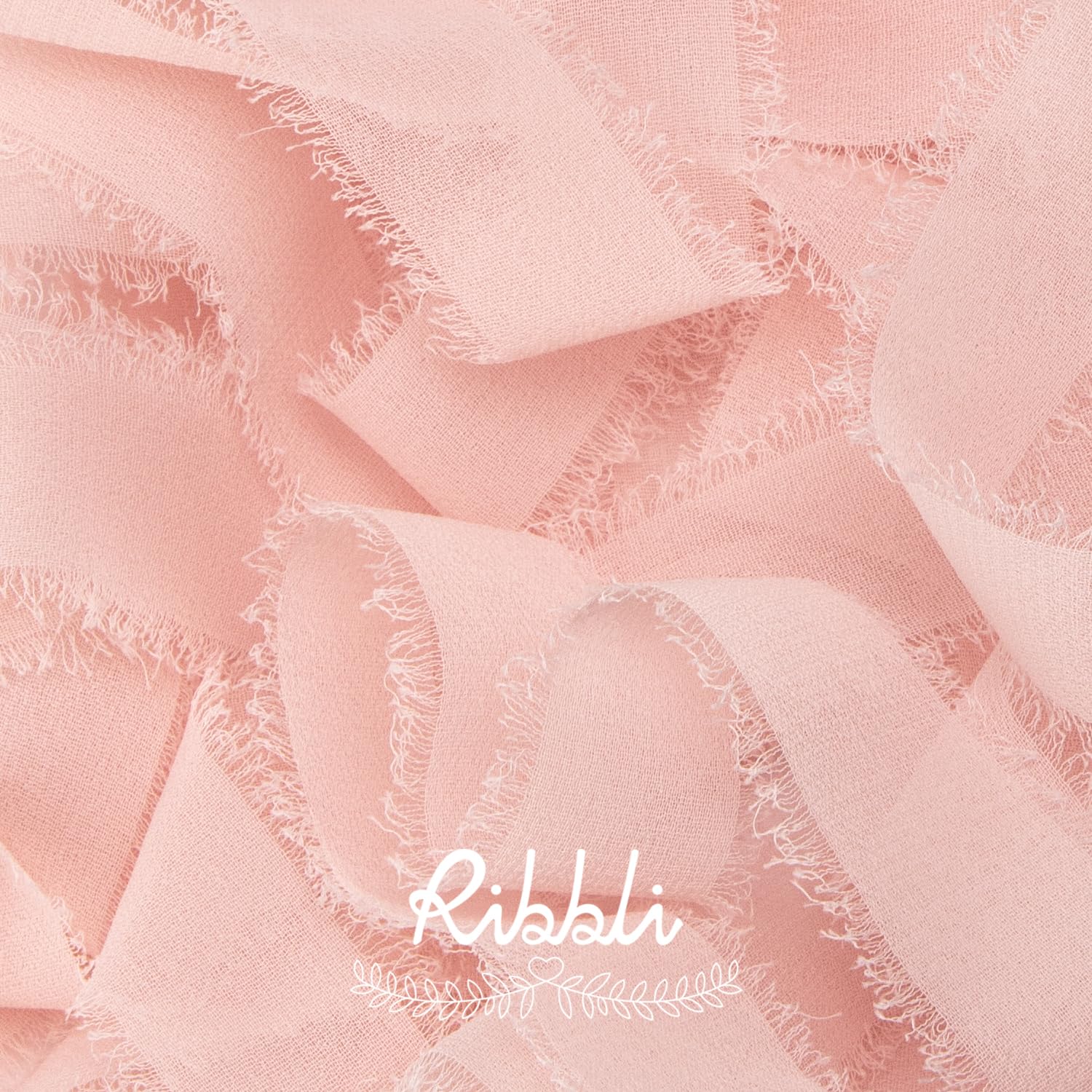 Ribbli fringe edge close-up showing handmade chiffon texture.