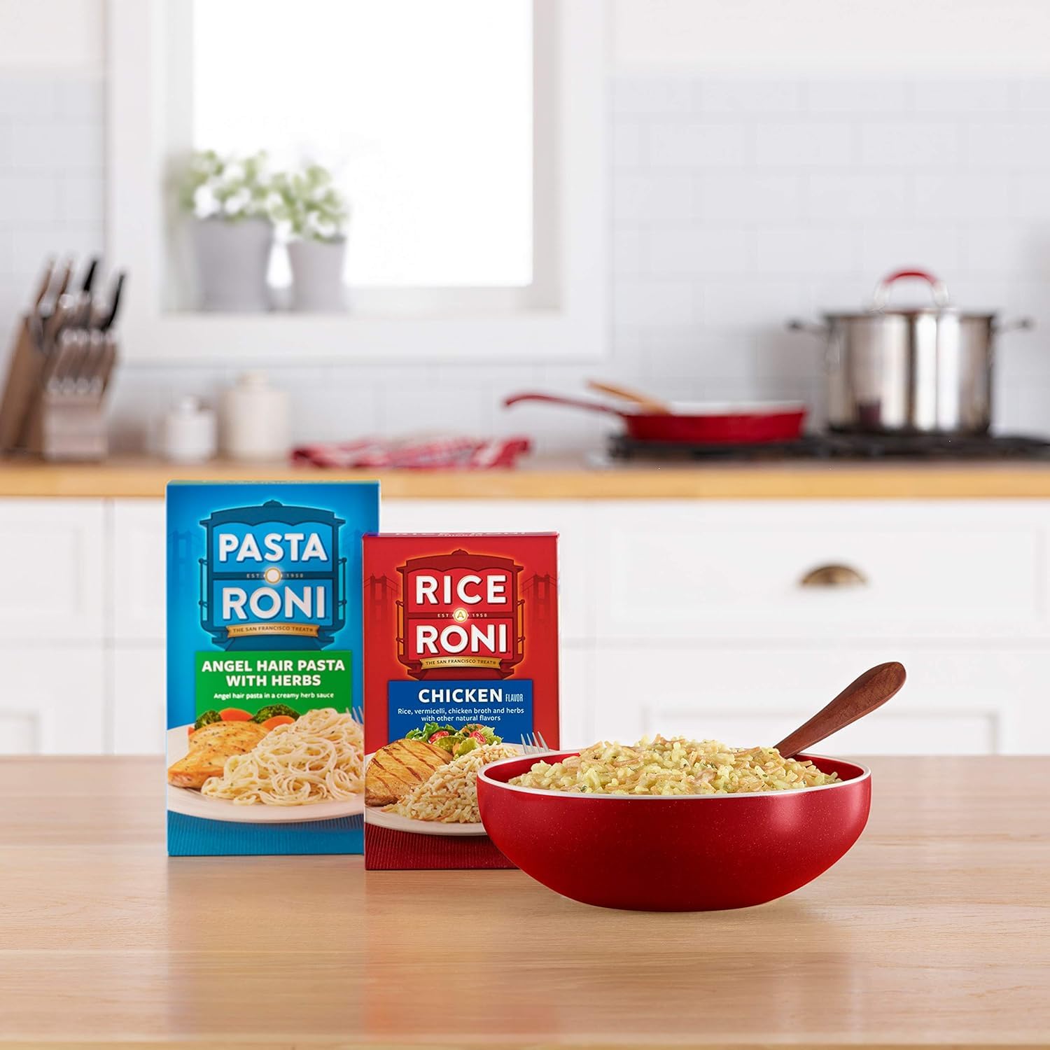 Rice-A-Roni Rice Pilaf container with serving, highlights 7 grams protein per serving.