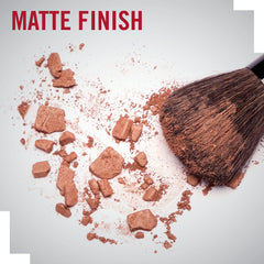 Rimmel London bronzer being blended on the cheeks for subtle warmth.