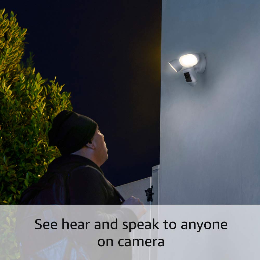 Ring Floodlight Cam side view highlighting motion-activated lighting during dusk.