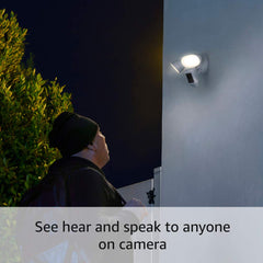 Ring Floodlight Cam side view highlighting motion-activated lighting during dusk.