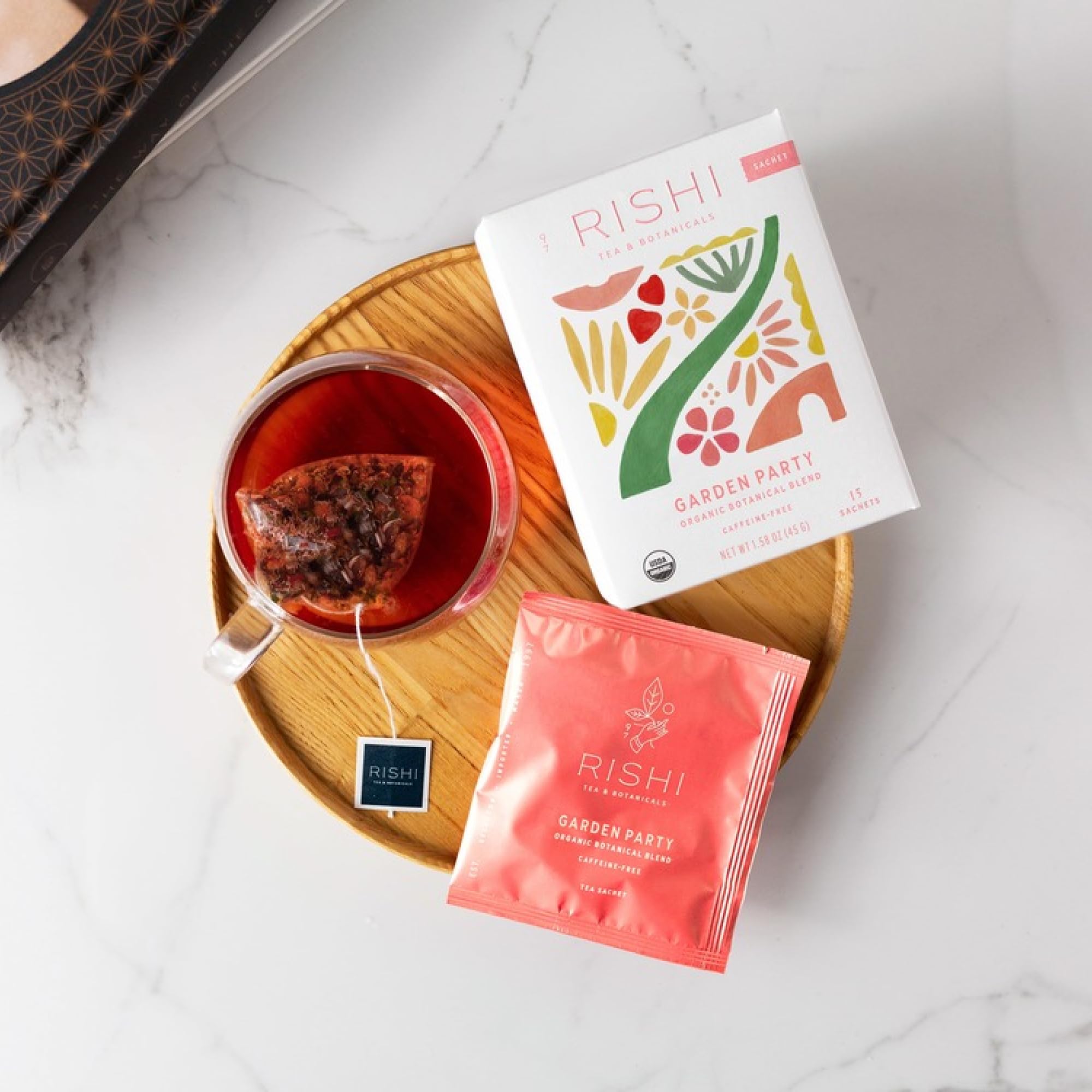 Rishi Garden Party fresh-cut strawberry accents in sunlit tea.