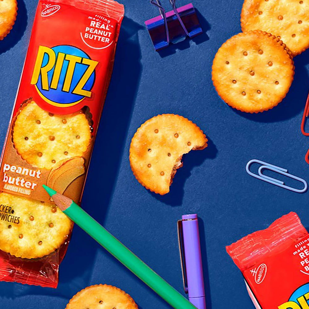 Pantry shelf featuring Ritz crackers and snack packs