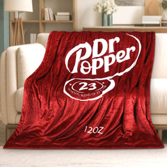 RMKA Dr Pepper blanket logo closeup highlights vibrant print and soft fleece texture.