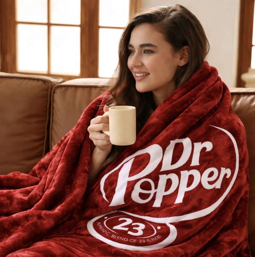 RMKA Dr Pepper blanket demonstrates a soft flannel feel, ideal for couch lounging and movie nights.