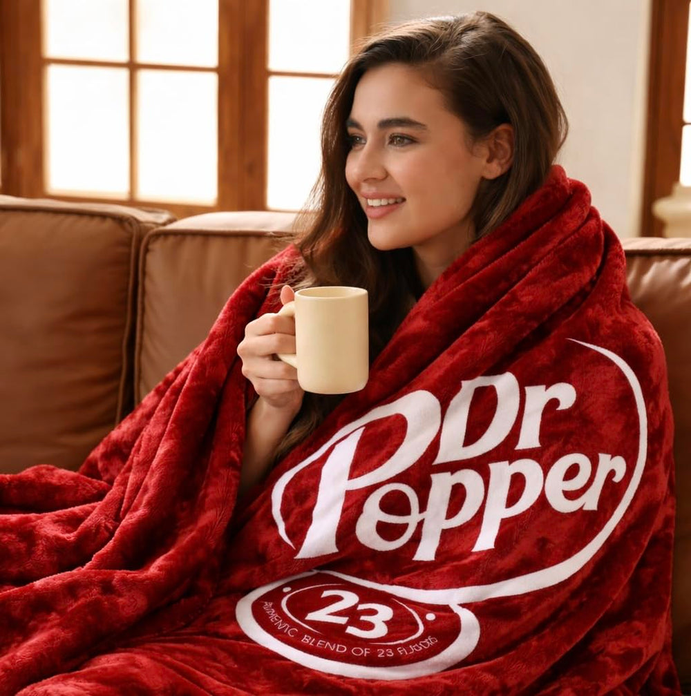 RMKA Dr Pepper blanket demonstrates a soft flannel feel, ideal for couch lounging and movie nights.
