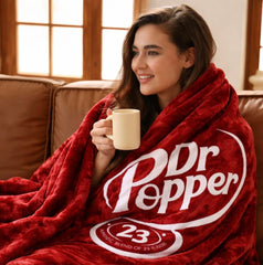 RMKA Dr Pepper blanket demonstrates a soft flannel feel, ideal for couch lounging and movie nights.