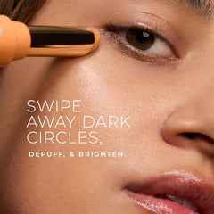 RoC revive glow eye balm under-eye application close-up showing the touchless wand