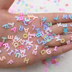 ROFIBUT 3D alphabet charms catch light for eye-catching nail designs.