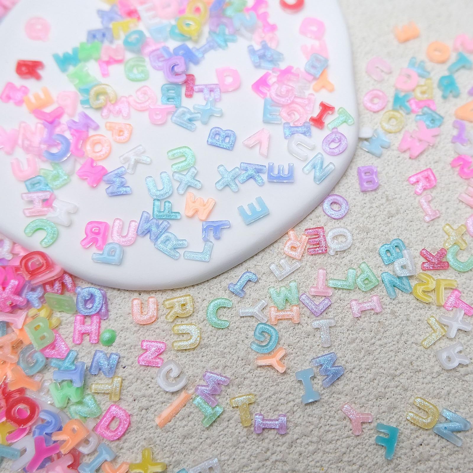 ROFIBUT nail charms with flat backs help secure adhesion.