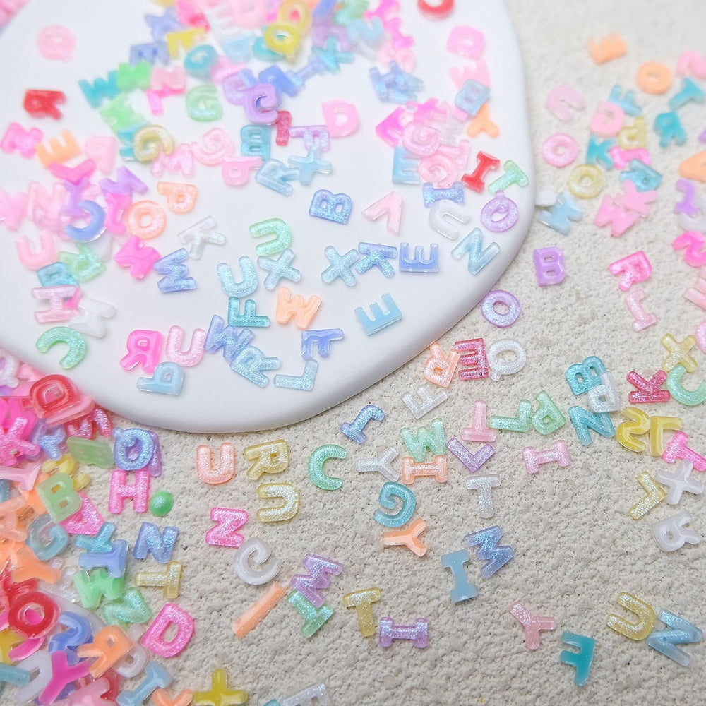 ROFIBUT nail charms with flat backs help secure adhesion.