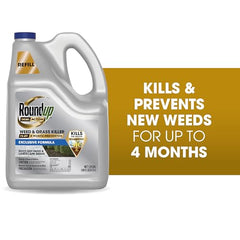 Roundup Dual Action Weed Killer along a fence line to control weeds.