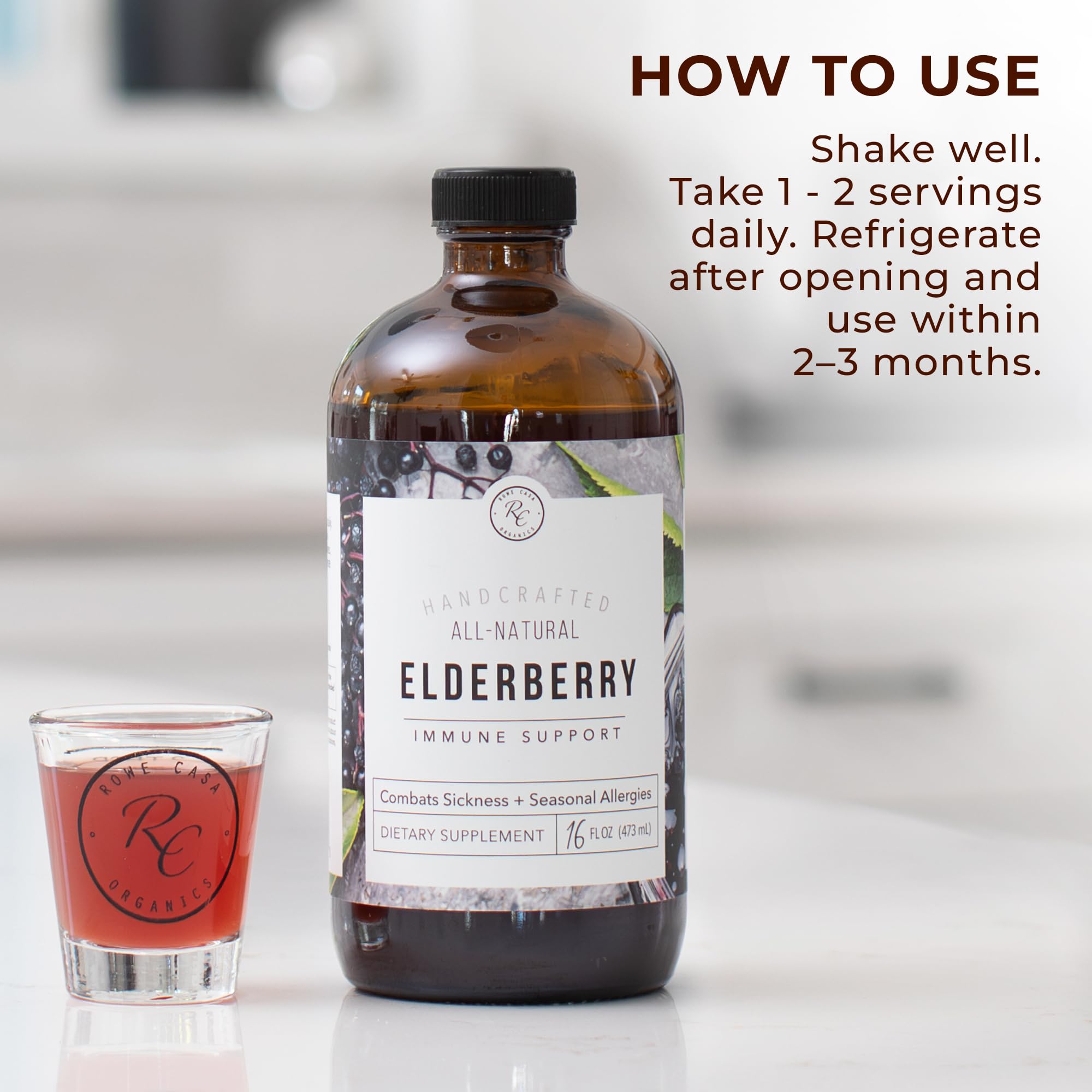 Rowe Casa Organics Elderberry glass bottle bathed in light, premium packaging.