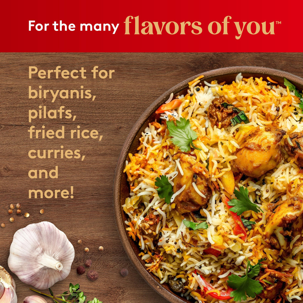 Royal Basmati rice beside a curry dish, ideal pairing and texture.