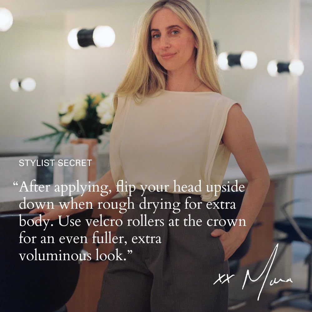 RŌZ Milk Hair Serum in hand showing hydration boost.